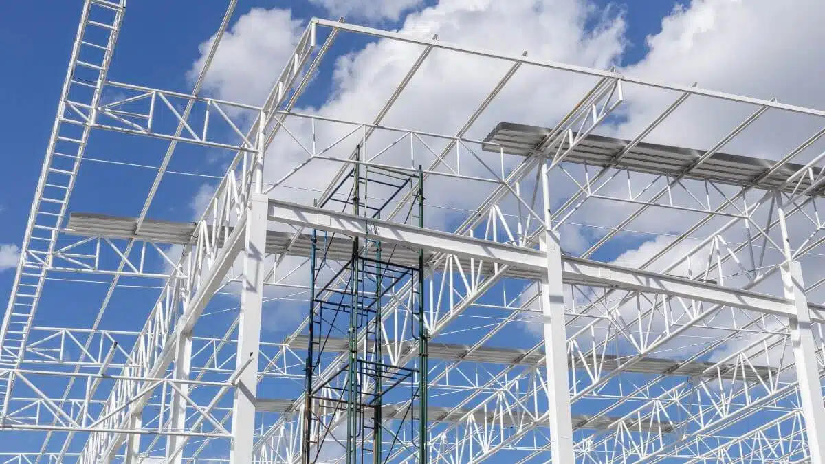 Workers assemble prefabricated construction modules at the site, streamlining the building process with efficiency and precision.